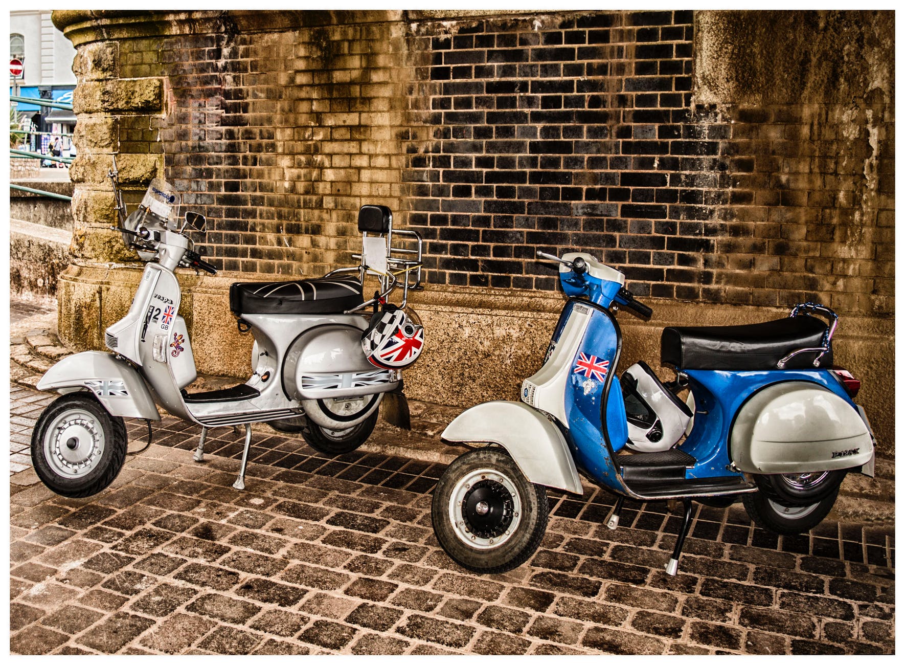 white and blue scooter motorcycles